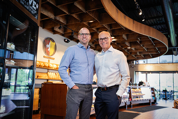 Peter and Eric Olesen in an O&H Danish Bakery store