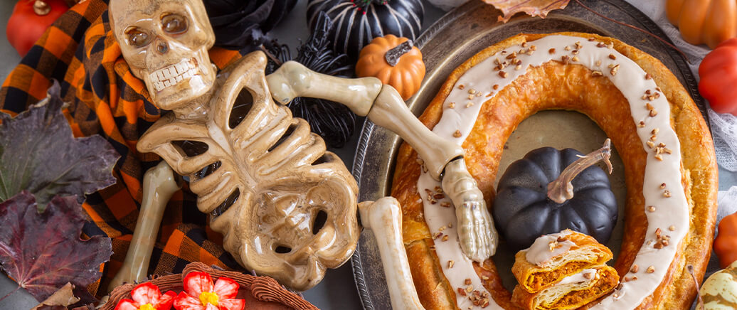 Day of the Dead Layer Cake and Pumpkin Caramel Kringle on a halloween dessert buffet