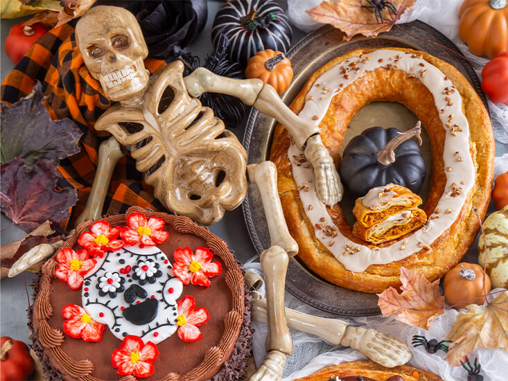 Day of the Dead Layer Cake and Pumpkin Caramel Kringle on a halloween dessert buffet