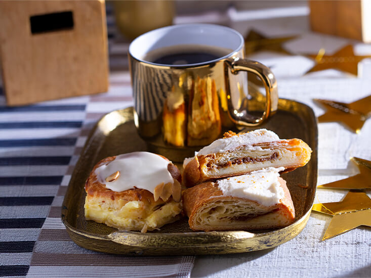 Coffee, Coffee Cake, and Kringle slices on a platter