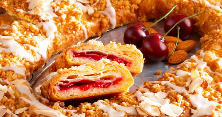 This Racine Kringle, featuring smooth almond filling and tart Montmorency cherries from Door County, Wisconsin, is a must-have for your Christmas celebrations!