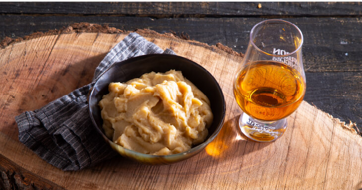 Bourbon and Butterscotch Kringle features layers of butterscotch, bourbon-infused caramel pudding, buttery streusel, and a honey glaze with oak essence.