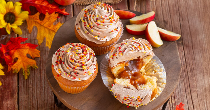 Jumbo cupcakes topped with luxurious cinnamon buttercream and colorful sprinkles.