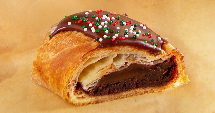 Enjoy the rich flavors of our delightful Danish kringle with chocolate fudge, crafted in Racine, and experience the holiday magic with every bite.