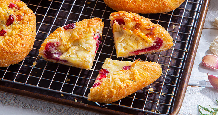 A mouthwatering danish pastry filled with creamy brie and tangy cranberry, baked to golden perfection?an irresistible treat perfect for any gathering.