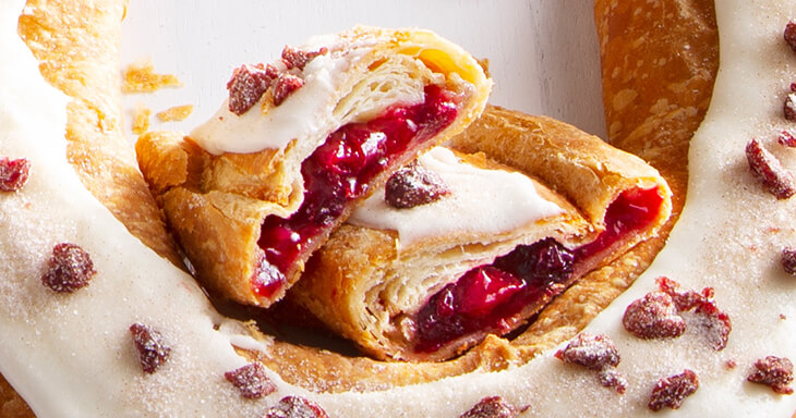 Cranberry Kringle, a delightful Racine Kringle that combines tangy cranberries with a flaky, buttery pastry, perfect for enjoying a taste of Wisconsin's finestkringles.