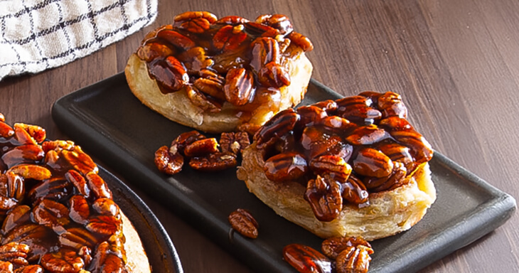 Our Danish Pecan Sticky Buns feature artisan pastry swirled with brown sugar and cinnamon, topped with Grade A pecans and caramel, delivering a warm, decadent treat perfect for any occasion.