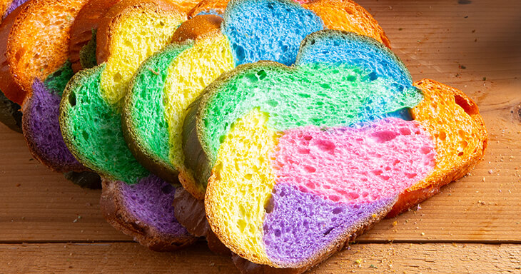 Colorful slices of vibrant braided Easter bread, a festive and delicious addition that?s sure to impress at your Easter brunch.