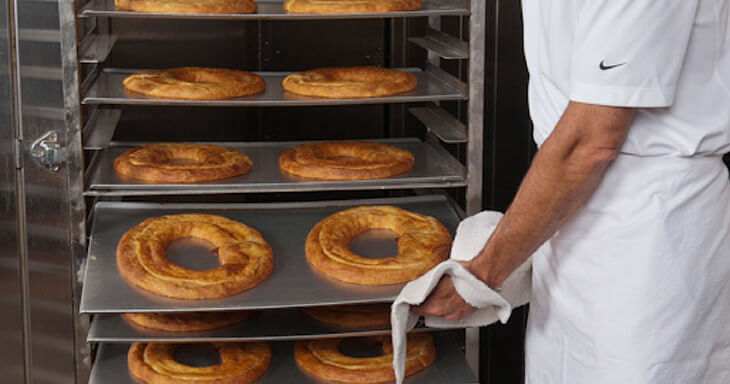 Freshly baked golden-brown kringle from O&H Danish Bakery, showcasing quality craftsmanship and artisan baking.