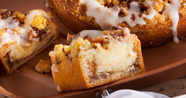 Experience the ultimate coffee cake delivery with our delectable coffee cake, featuring smooth custard and a delightful pecan topping, crafted to perfection for an indulgent treat.