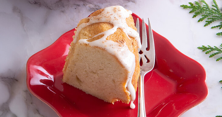 Our White Christmas Bundt Cake, made from our special homemade eggnog recipe and topped with nutmeg, perfect for holiday celebrations by the fire!